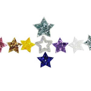 May include: Assortment of ten star-shaped fabric patches with sequin embellishments in various colors, including pink, gold, yellow, blue, purple, and white.