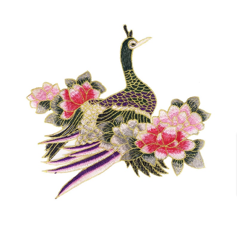 May include: An embroidered patch depicting a peacock with purple and green feathers, standing in a bed of pink and white flowers. The patch is outlined in gold thread.