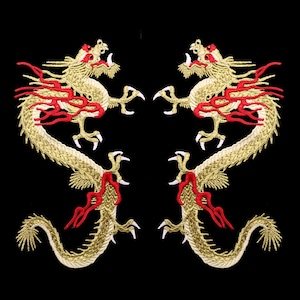 May include: Two gold embroidered iron-on patches of dragons with red accents. The dragons are facing each other with their tails curled around their bodies.