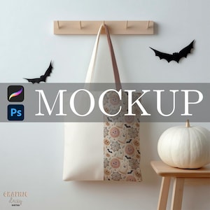 May include: A white tote bag with a brown handle and a Halloween-themed pattern. The pattern includes ghosts, pumpkins, and spiderwebs. The word "MOCKUP" is displayed in large white letters across the image.