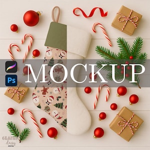 May include: A festive Christmas-themed flat lay featuring a stocking, candy canes, ornaments, wrapped gifts, and greenery. The stocking has a patterned design with snowmen and trees. Red and white candy canes and ornaments are scattered around the stocking.