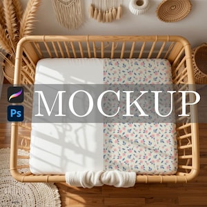May include: A baby crib with a floral patterned sheet and a plain white sheet. The word "MOCKUP" is displayed across the sheets. The crib is made of light brown wood.