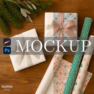 May include: Two wrapped gifts with cream-colored bows, one with a patterned top. Rolls of wrapping paper in various designs, including Christmas trees and ornaments. The word "MOCKUP" is displayed in large white letters.