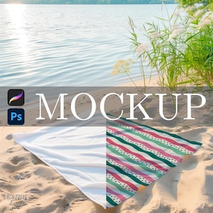 May include: A beach towel mockup with a white side and a patterned side featuring stripes in pink, green, and teal. The word "MOCKUP" is displayed in large white letters. The scene is set on a sandy beach with water and greenery in the background.