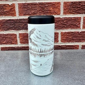 May include: A set of three ceramic mugs with a speckled, matte finish in cream, light grey, and dark grey. Each mug has a minimalist design, ideal for tea or coffee.