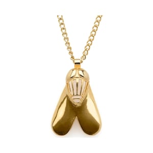 May include: A gold chain necklace with a pendant shaped like a fly. The fly's wings are gold and the body is white with a gold outline.