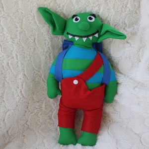 Petit ogre qui voulait aller à l'école, marotte avec son cartable pour raconter des histoires