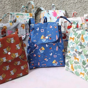 Sac maternelle, sac à dos en coton oeko tex ,fermeture sur le devant par pression sur le rabat