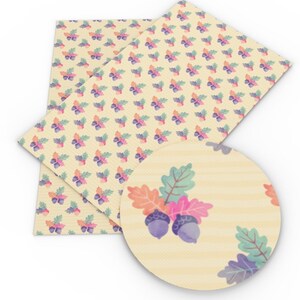 May include: A sheet of cream-colored faux leather with a repeating pattern of purple, pink, and green acorns and leaves.