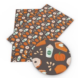 May include: A sheet of brown faux leather with a repeating pattern of pumpkin pie slices, donuts, coffee cups, and pumpkins. The pattern is on a dark brown background.