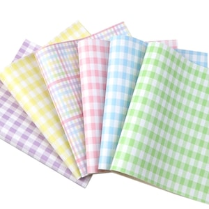 May include: Six sheets of faux leather in pastel gingham patterns. The sheets are in shades of lavender, yellow, light blue, pink, and green.