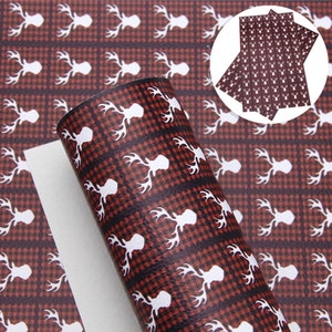 May include: A sheet of brown faux leather with a white deer head pattern on a red and black buffalo plaid background. The sheet is rolled up and has a white backing.