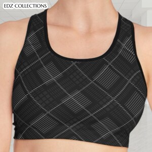 May include: Black sports bra with a gray plaid pattern. The bra has a scoop neck and a racerback design. The brand name "EDZ COLLECTIONS" is visible in the upper left corner.