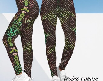 May include: Black leggings with a colorful dot pattern and floral accents. The leggings have a repeating pattern of small dots in shades of green, yellow, and pink. The text "tropic venom" and "EDZ COLLECTIONS" is visible.