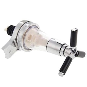 May include: A chrome-finished liquor pourer featuring a clear plastic conical body, a black ribbed rubber stopper at the base, and a three-pronged handle with black cylindrical grips for dispensing liquid from a bottle with precision control.