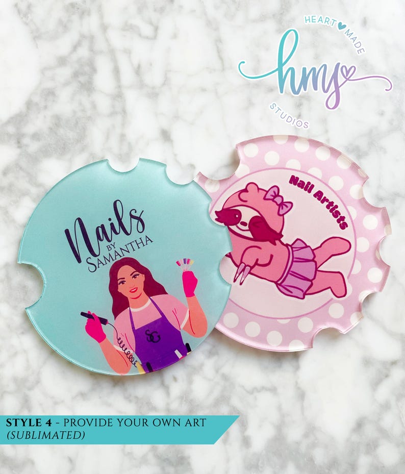 May include: Two round coasters with a scalloped edge. The left coaster is light blue with the text "Nails by Samantha" in black and a woman with pink gloves holding a nail drill. The right coaster is pink with white polka dots and a pink sloth wearing a pink tutu and a pink bow. The text "Nail Artists" is in black.