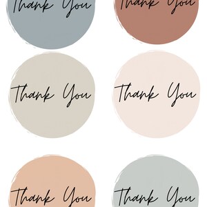 May include: Six circular stickers with the words "Thank You" in a handwritten font. Each sticker has a different coloured background, including blue, brown, beige, pink, peach, and grey. The stickers have a brush stroke border.