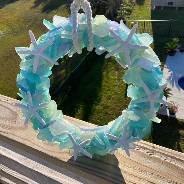 16”d Sea glass wreath with starfish and rope hanger.