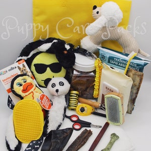 May include: A yellow tote bag filled with various dog supplies, including toys, treats, a brush, training pads, and a chew bone. The bag also includes a small stuffed dog toy shaped like a poodle.