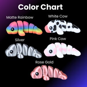 May include: A colour chart shows articulated toy worms in different colours. Options include matte rainbow, white cow, silver, pink cow, and rose gold. Each worm has a segmented body and a small, round eye.