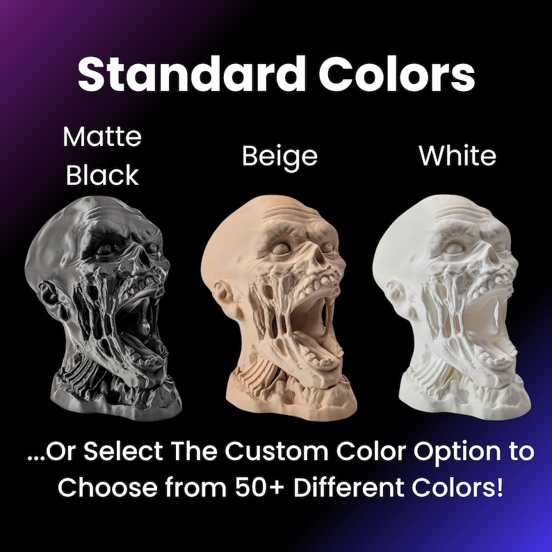 May include: Three 3D printed zombie heads in different colors: matte black, beige, and white. The heads are all open-mouthed and have a distressed, zombie-like appearance. The text "Standard Colors" is at the top of the image, and the text "...Or Select The Custom Color Option to Choose from 50+ Different Colors!" is at the bottom.
