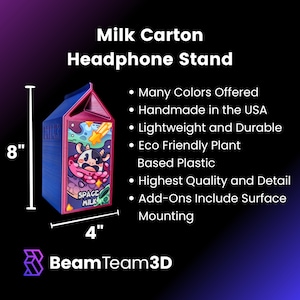 May include: A 3D printed milk carton headphone stand, 8 inches tall and 4 inches wide. The carton is blue and pink with a space-themed design and the words "Space Milk".