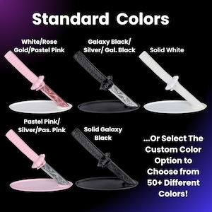 May include: An image showcasing miniature decorative katana knives in various colors, including pink, black, and white. The text "Standard Colors" is at the top, with options like "White/Rose Gold/Pastel Pink" and "Galaxy Black/Silver/Gal. Black".