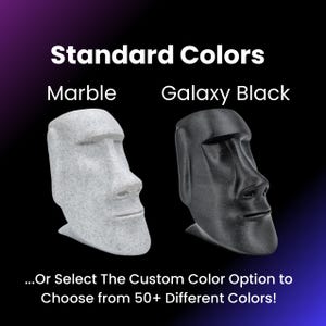 May include: Two 3D printed busts of a human face, one in a marble-like finish and the other in black. The text "Standard Colors" is above the busts, and the text "Marble" is above the white bust and "Galaxy Black" is above the black bust. The text below the busts reads "...Or Select The Custom Color Option to Choose from 50+ Different Colors!"