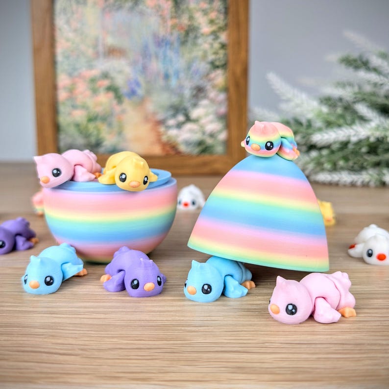 May include: A collection of colorful, handmade polymer clay figurines. The figurines include small, stylized animals in various colors, such as pink, yellow, blue, and purple. A rainbow-striped bowl and a rainbow-striped cone-shaped object are also present.