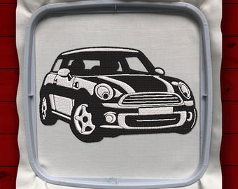 May include: Black and white embroidered design of a Mini Cooper car on a white fabric background.