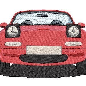 May include: A red vintage sports car with black headlights and a white number plate. The car is facing forward and the front bumper is visible.