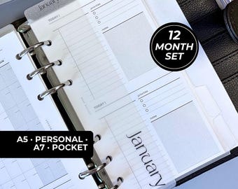 May include: A planner insert set featuring translucent dividers with the text January, daily planning pages with sections for priorities and notes, and a 12 month set label. The pages are held by silver metal rings in a black binder.