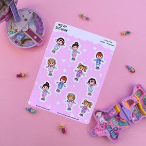 May include: A sheet of pink stickers featuring illustrations of cartoon girls with different hairstyles and outfits. The stickers are titled "Pony Dolls" and "Set 003 - Bubblegum".