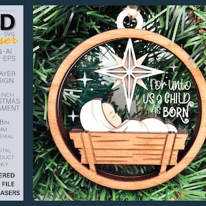 May include: A wooden Christmas ornament, 8.9 cm in diameter, with a layered design. It features a star, the text "For unto us a child is born", and a depiction of baby Jesus in a manger. The ornament is made of wood.