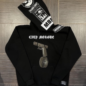 Hoodie with print C-Mag Magazine 9 mm Glock
with studs patches
patched hoodie for gift