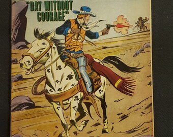 May include: A vintage comic book cover featuring a cowboy riding a spotted horse and firing a gun. The cover is titled "Billy the Kid" and the issue number is 63. The tagline is "Day Without Courage".