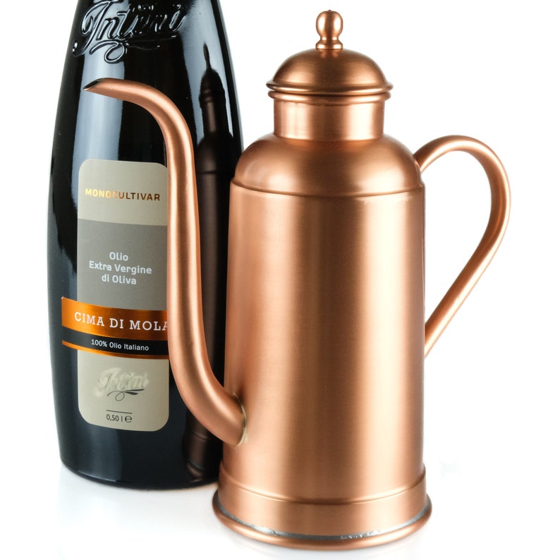 Olive oil dispenser. Copper oil cruet with long and curved spout, is