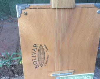 cigar box guitar, fretless, slide guitar