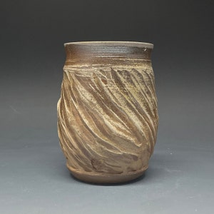 Wood Fired Salt Glazed Vase with White Stoneware Slip texture atop Brown Stoneware Clay