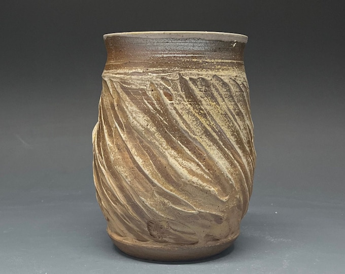 Wood Fired Salt Glazed Vase with White Stoneware Slip texture atop Brown Stoneware Clay