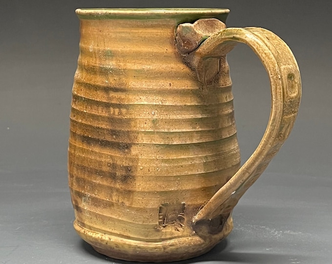 Wood Fired Salt Glazed Stoneware Mug with Florida impressed handle and herringbone foot.
