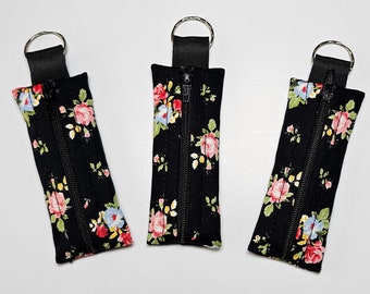 Support pour baume à lèvres, pochette pour baume à lèvres avec fermeture éclair, cadeaux d'anniversaire pour femme, porte-clés baume à lèvres floral noir