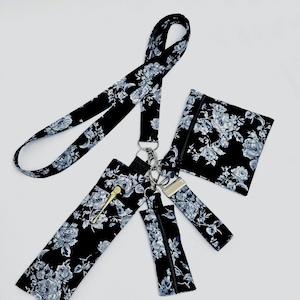 Tour de cou à fleurs noirs, accessoires de rentrée, cadeaux pour l'enseignant, porte-monnaie et porte-stylos.