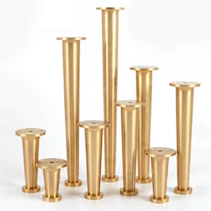 May include: Set of eight gold metal furniture legs of varying heights. The legs are tapered and have a smooth, polished finish.