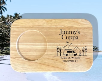 May include: A rectangular wooden serving tray with a circular indentation for a cup. The tray features the text "Jimmy's Cuppa" and a graphic of a campervan, trees, and mountains. The phrase "HOME IS WHERE YOU PARK IT" is also included.