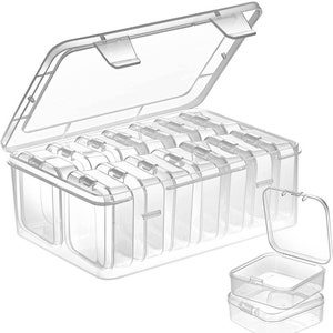 May include: A clear plastic storage box with a hinged lid and 12 individual compartments. The box is designed to hold small items, such as beads, buttons, or jewelry. Two additional small clear plastic boxes are shown stacked on top of each other.