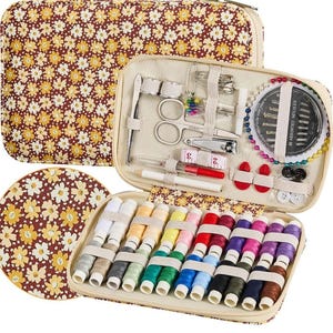 May include: A floral-patterned sewing kit with a variety of tools and colorful thread spools. The kit includes scissors, needles, measuring tape, and buttons. The case is beige with a daisy-like floral pattern in brown and yellow.