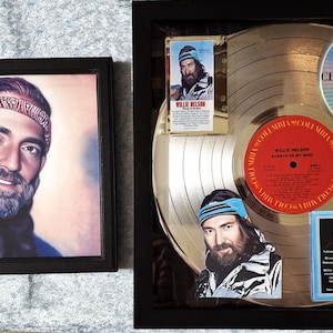 May include: A framed gold record award with a silver record inside. The record is signed by Willie Nelson and has the title "Always On My Mind" on the label. The award also includes a small framed photo of Willie Nelson.