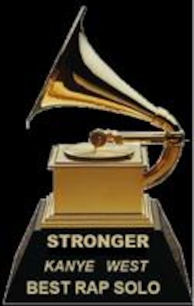 May include: A gold-colored Grammy Award trophy with a gramophone design. The base is black and features the text "STRONGER KANYE WEST BEST RAP SOLO."
