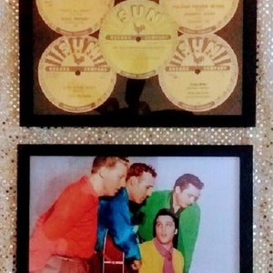 May include: A framed black and white photo of four men, likely a band, with a guitar in the center. The photo is titled "The Million Dollar Quartet" with the names Jerry Lee Lewis, Carl Perkins, Elvis Presley, and Johnny Cash listed below. Above the photo is a framed display of five vintage vinyl records with the label "Sun Records Company" printed on each.